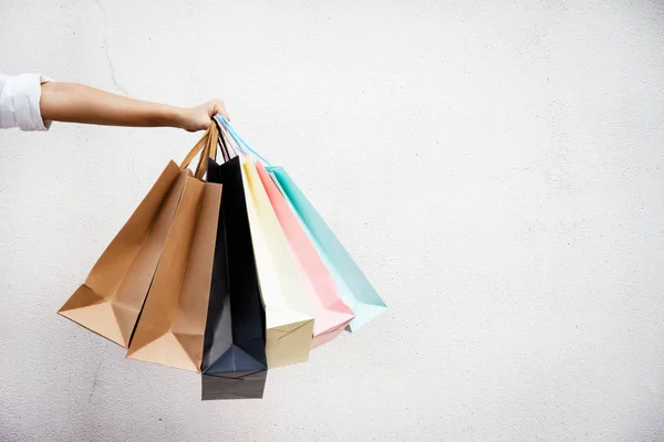 Shopping bags of women crazy shopaholic person at shopping mall.colorful paper shopping bags.