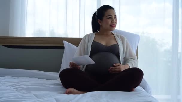 Pregnant Woman Sitting Bed — Stock Video