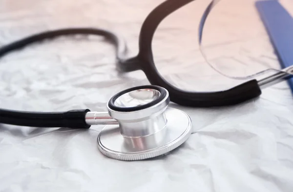 Closeup head of the stethoscope on background,blurry light around