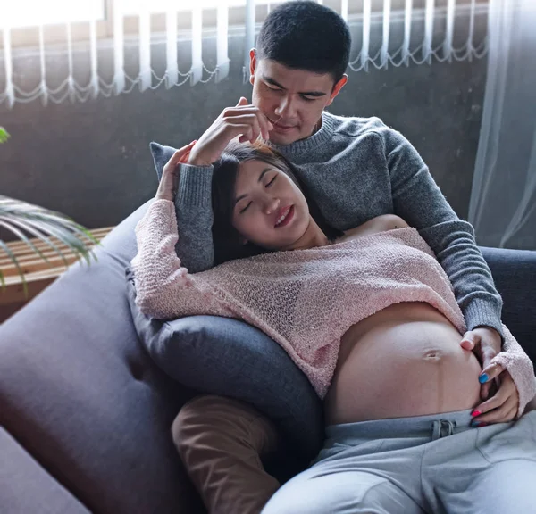 Pregnant Woman Laying Sofa Hugging Her Husband Put Hand Touch — Stock Photo, Image