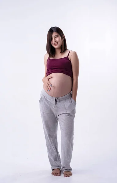 Pregnant Woman Standing Put Hand Touching Her Bellywith Love Care - Stock-foto