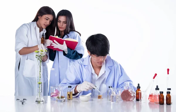 The scientists conducting experiments in laboratory,team of researchers in Chemical and nature organic extract,aromatic essential research in Lab test