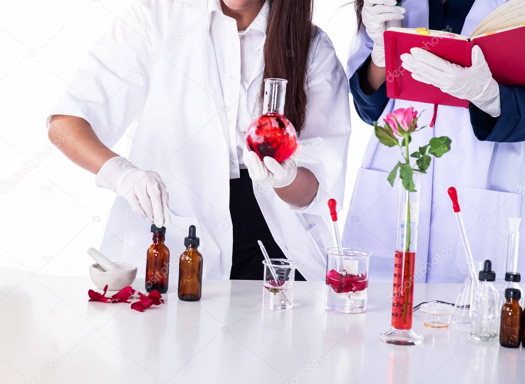 Hands of scientists conducting experiments in laboratory,team of