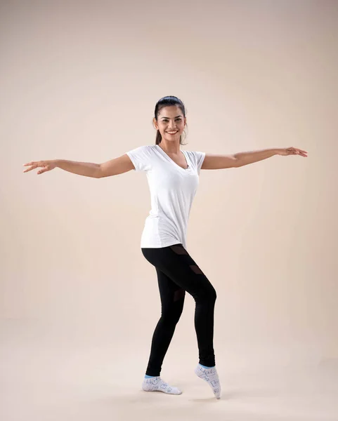 Young Lady Standing Feet Apart Twisted Little Point Toe Stretch — Stock Photo, Image