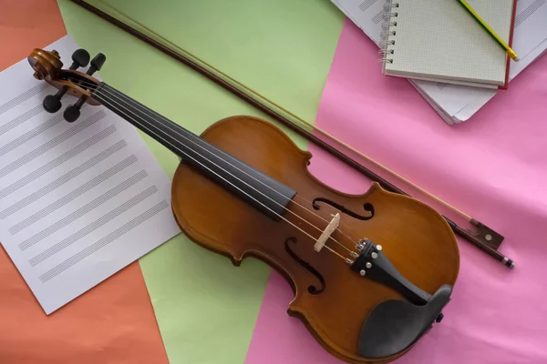 Violin and bow put on colorful background,prepare for practice