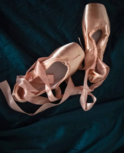 Top view of  satin ballet shoes put on background