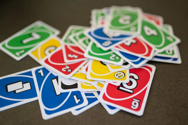 Uno Game Cards Scattered All Over the Frame and One Card Showing the Reverse  Side with Uno Logo Close-up Editorial Photo - Image of shedding, yellow:  144396811