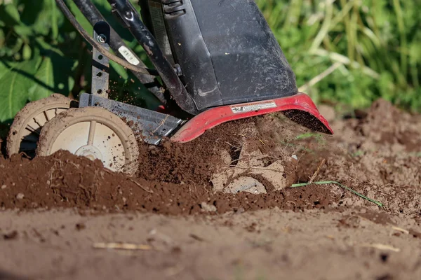 Tiller Action Digging Spewing Dirt Soil Garden — Stock Photo, Image