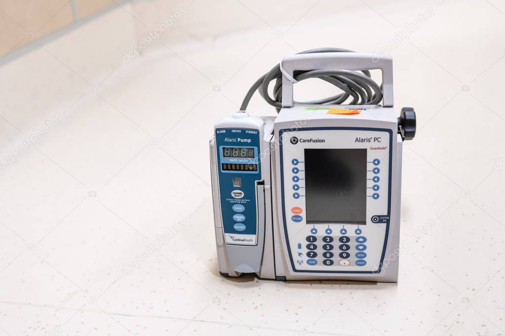 Portland, OR / USA - September 29 2018: Alaris CareFusion pump - a medical infusion device for delivery of fluids, medications, blood and blood products through IV.