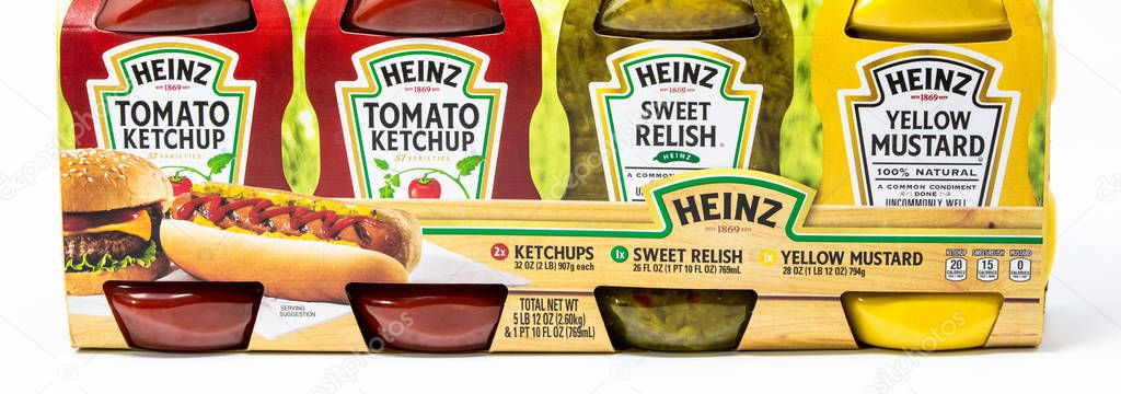 Portland, OR / USA - October 13 2018:  Heinz brand ketchup, yellow mustard and sweet relish in plastic bottles, isolated on white background.