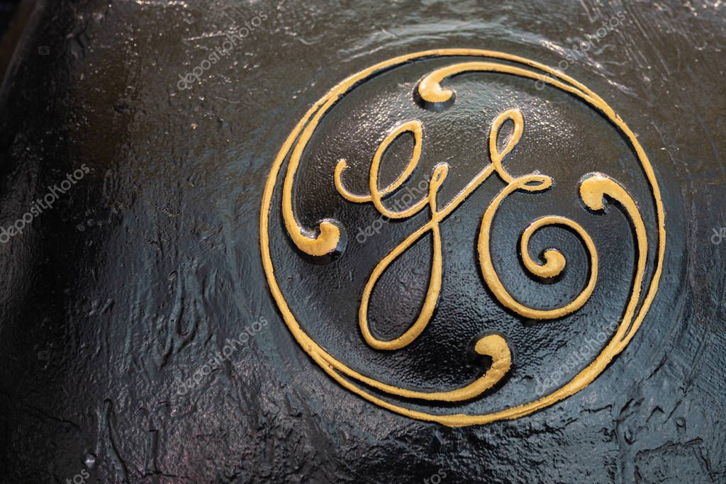 Portland, OR / USA - November 11 2018: Vintage General Electric (GE) logo engraved onto black metal surface.