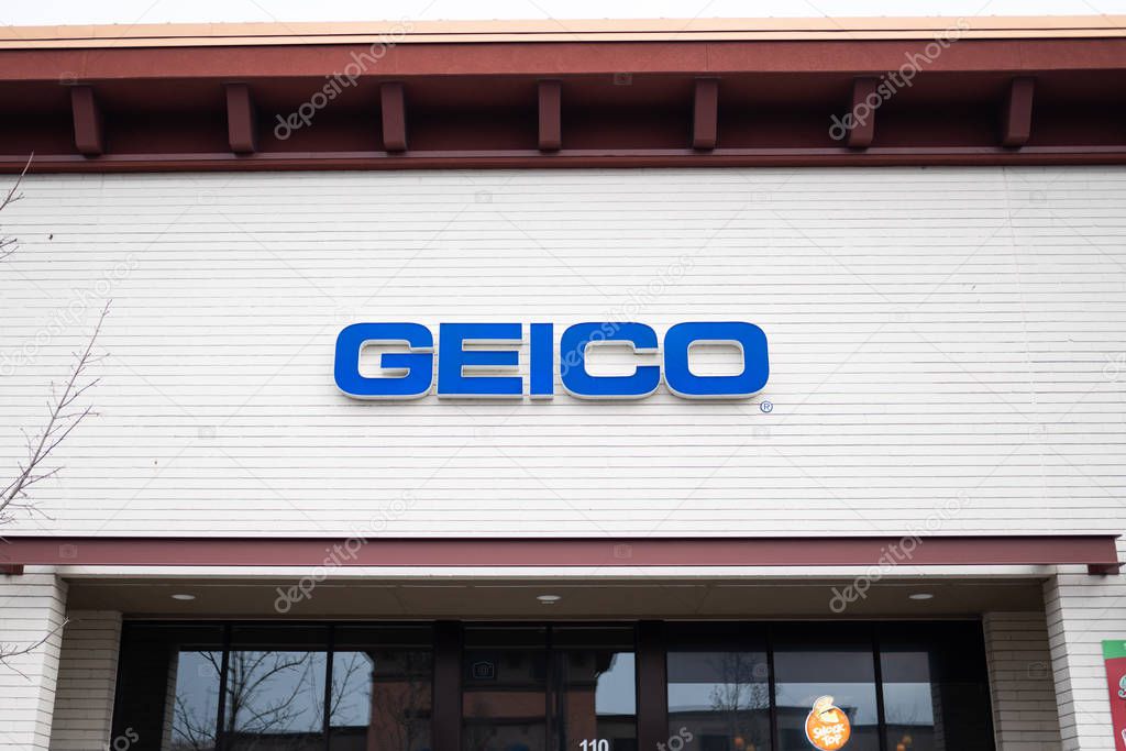 Portland, OR / USA - December 20 2018: Geico insurance business front with a blue logo.