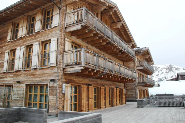 Wooden Lodge House at Winter in the Mountains