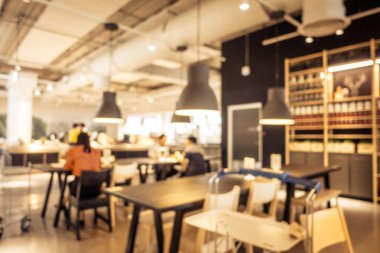 Arka plan için soyut bulanıklık ve odaklanmış kahve dükkanı ve restoran iç mekanı