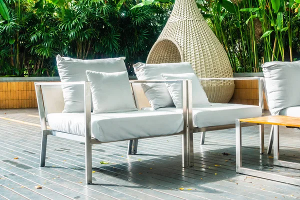 Comfortable pillow on sofa decoration outdoor patio with tropical and nature view