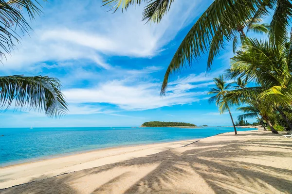 Beautiful tropical beach sea and sand with coconut palm tree on blue sky and white cloud for travel and vacation