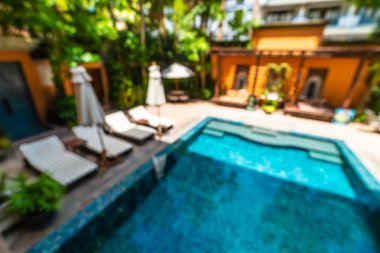 Seyahat ve tatil için güzel otel resort ve yüzme havuzu arka plan bulanıklık