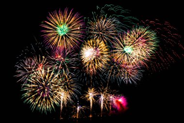 Beautiful color fireworks display on black sky at night for celebration clipart