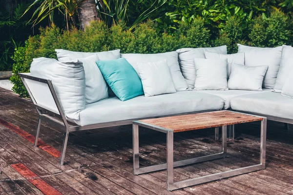 Comfortable pillow on sofa decoration outdoor patio with tropical and nature view