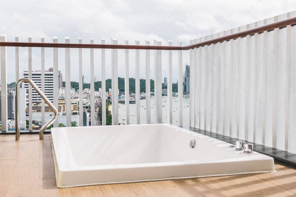 Beautiful white bathtub and jacuzzi bath decoration outdoor exterior of balcony or patio