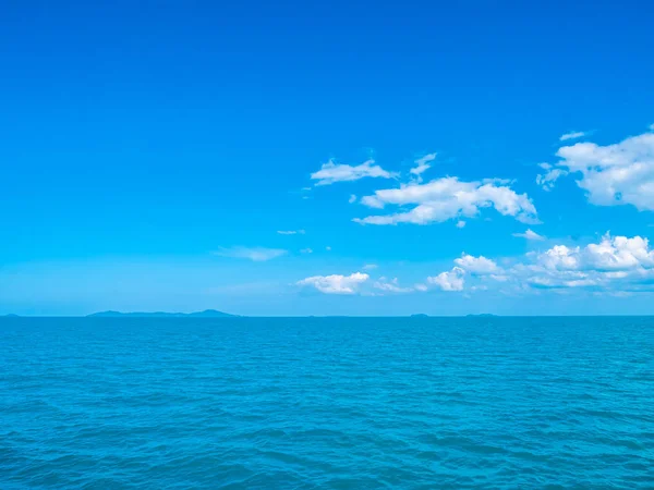 Beautiful sea and ocean on white cloud and blue sky background with copy space for text