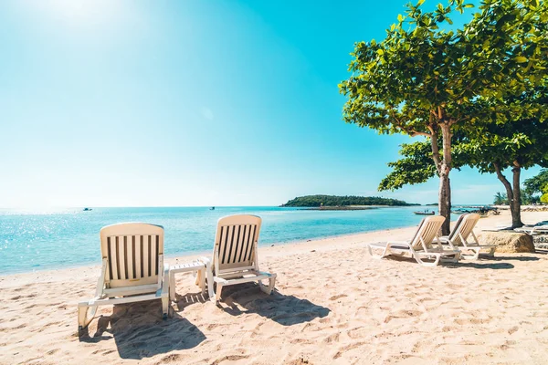 Beautiful tropical beach and sea with chair on blue sky for travel and vacation