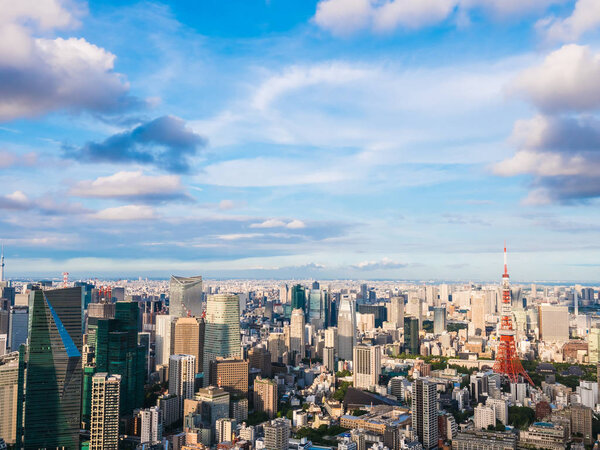 Beautiful Architecture and building around tokyo city with tokyo tower in japan with blue sky and white cloud
