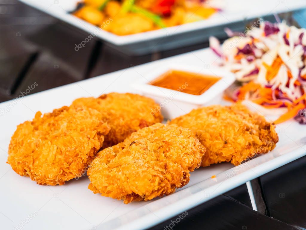 Deep fried shrimp cake with sweet sauce in white plate - Thai food style