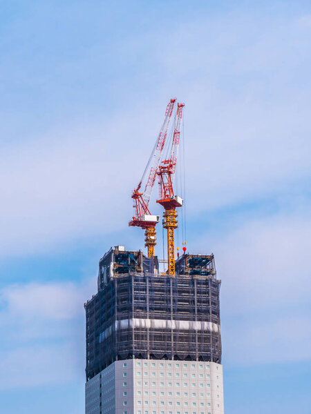 Crane building under construction exterior with sky background