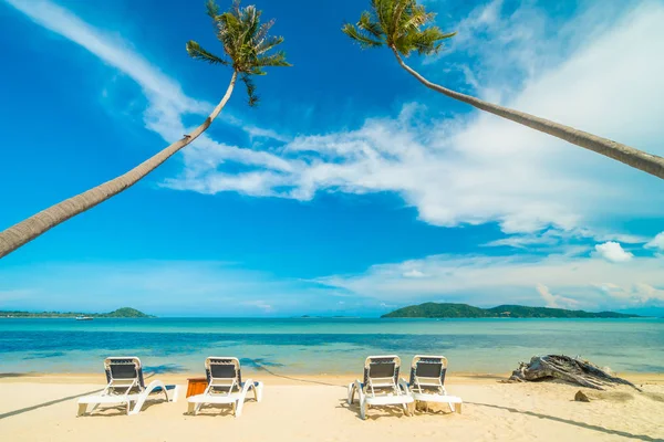 stock image Beautiful tropical beach and sea with coconut palm tree and chair in paradise island