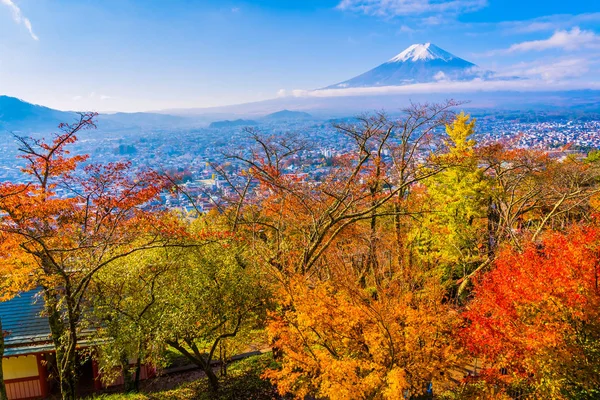 Beautiful landscape of mountain fuji around maple leaf tree with white cloud and blue sky in autumn season at Yamanashi Japan