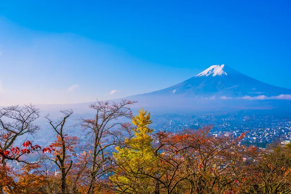 Beautiful landscape of mountain fuji around maple leaf tree with white cloud and blue sky in autumn season at Yamanashi Japan