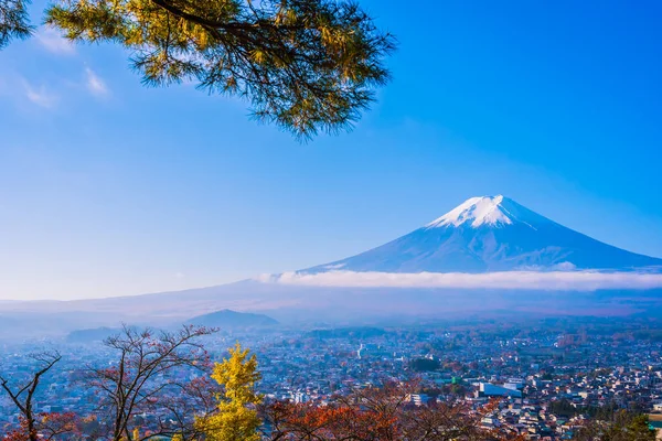 Beautiful landscape of mountain fuji around maple leaf tree with white cloud and blue sky in autumn season at Yamanashi Japan