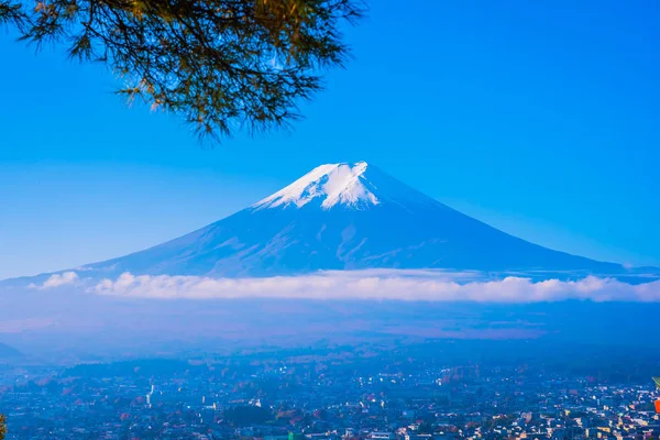 Beautiful landscape of mountain fuji around maple leaf tree with white cloud and blue sky in autumn season at Yamanashi Japan