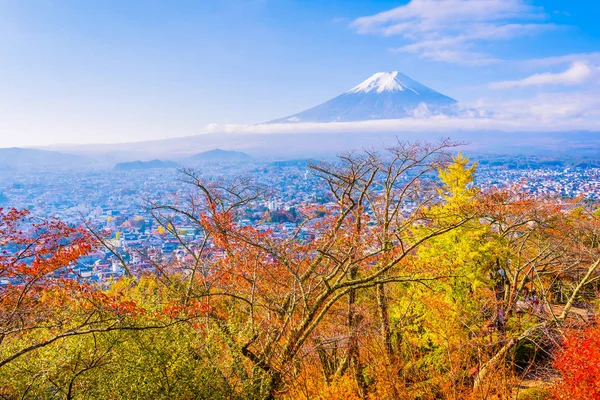 Beautiful landscape of mountain fuji around maple leaf tree with white cloud and blue sky in autumn season at Yamanashi Japan