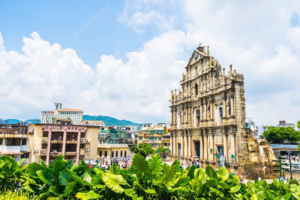 Beautiful old architecture building with ruin of st pual church landmark of macau city with blue sky background