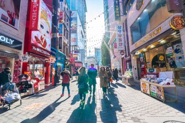 Seoul, South Korea 10 December 2018 : Myeong dong market is the popular place and district for shopping find something eat and sightseeing clipart