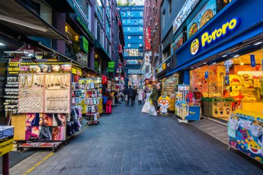 Seoul, South Korea 10 December 2018 : Myeong dong market is the popular place and district for shopping find something eat and sightseeing clipart