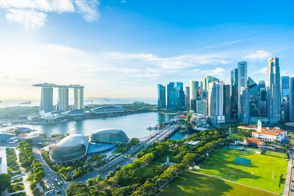 Beautiful architecture building exterior cityscape in Singapore city skyline with white cloud on blue sky