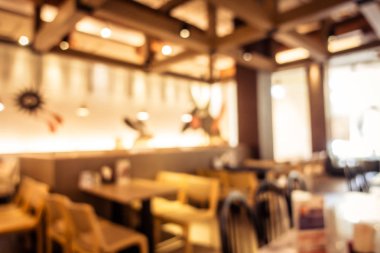 Arka plan için soyut bulanık kahve dükkanı iç mimarisi