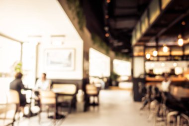 Arka plan için soyut bulanık kahve dükkanı iç mimarisi