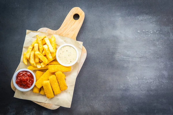 Fish finger and french fries or chips with tomato ketchup and ma — Stock Photo, Image