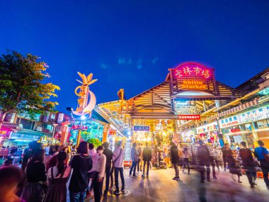 Taipei, Taiwan - December 1 2018 : Shilin night market is the po clipart