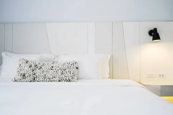 White pillow and blanket on bed decoration in beautiful luxury bedroom interior