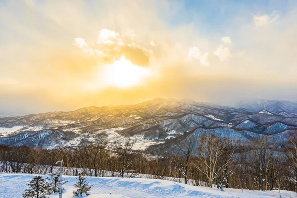 Beautiful landscape with mountain around tree in snow winter season at sunset time in Sapporo Hokkaido Japan