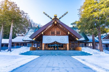 Beautiful architecture building temple of Hokkaido Shrine in Sapporo city in Snow winter season Japan clipart
