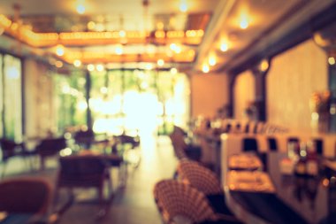 Arka plan için soyut bulanıklık ve odaklanmış kahve dükkanı ve restoran iç mekanı