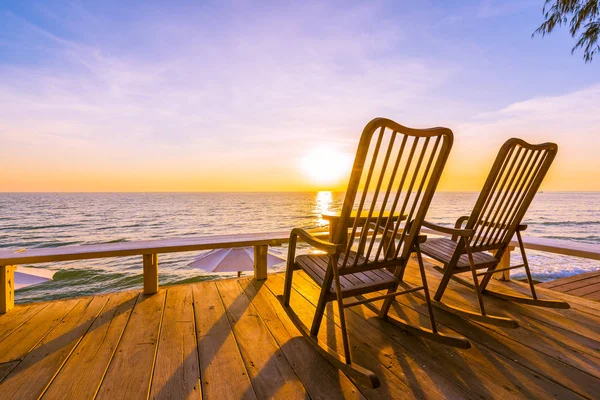 Empty wood chair and table at outdoor patio with beautiful tropi — Stock Photo, Image