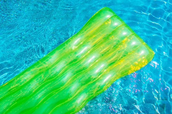 Colorful swim ring or rubber float around swimming pool water for leisure relax