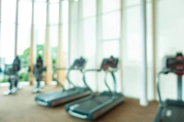 Abstract Blur en Defocus fitnessapparatuur in Gym kamer interieur — Stockfoto